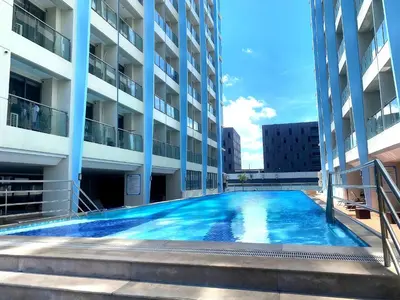 a large swimming pool in the middle of a building at City Center Executive Hotel Manila Near Airport, PITX, Solaire, City of Dreams, Okada & Ayala Mall in Manila