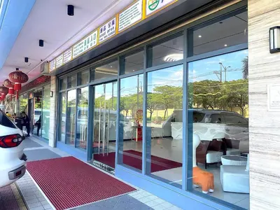 a store front of a car dealership with glass windows at City Center Executive Hotel Manila Near Airport, PITX, Solaire, City of Dreams, Okada & Ayala Mall in Manila