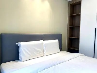 a bed with two pillows on top of it at City Center Executive Hotel Manila Near Airport, PITX, Solaire, City of Dreams, Okada & Ayala Mall in Manila