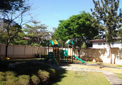 a playground with a slide in a yard at Spacious & Cozy 1-Bedroom, Sleeps 2-4 in Manila