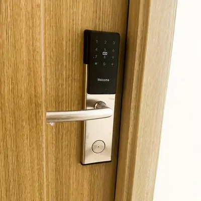 a door handle with a cell phone in it at Crizzy's Hub Gabrielle at Shore Residences in Manila