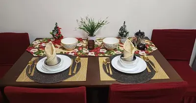 a table with a table set with plates and utensils at Mall of Asia's Staycation in Manila