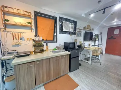 a kitchen with a sink and a counter top at Ortigas Condotel near Robinsons Galleria with free pool in Manila