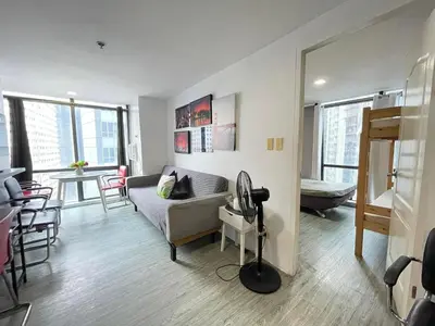 a living room with a couch and a table at Modern Condotel in Ortigas good up to 8 pax in Manila