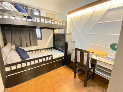 a small room with a bunk bed and a desk at East Raya Gardens Pasig near Ortigas BGC Eastwood in Manila