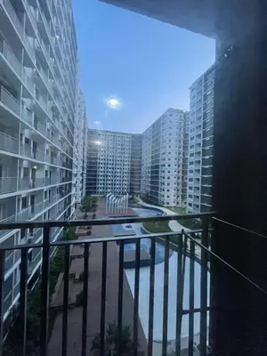 a balcony with a view of some tall buildings at Gen Travel Hub in Manila
