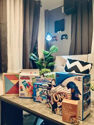 a table with boxes of food on it at Cloves Den Binangonan Your Ultimate Cinema Date in Binangonan