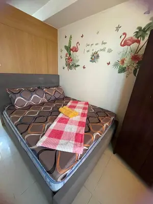 a small bedroom with a bed with a towel on it at Big cut room 3beds 1103 tower A in Manila