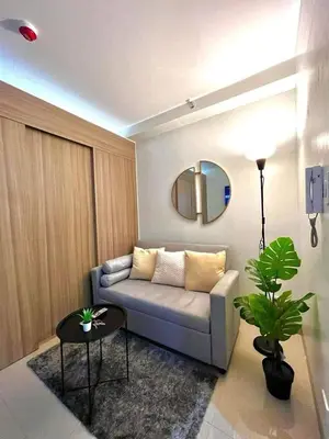 a living room with a couch and a table at Staycation Shore 2 Residences Tower 2 Pasay City in Manila