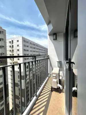 a balcony with a view of a building at Staycation Shore 2 Residences Tower 2 Pasay City in Manila