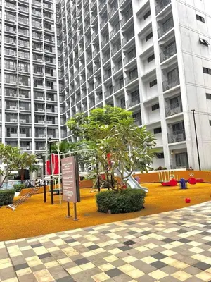 a park in front of a large building at Staycation Shore 2 Residences Tower 2 Pasay City in Manila
