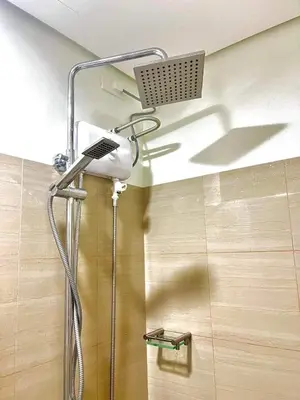 a shower with a shower head in a bathroom at Staycation Shore 2 Residences Tower 2 Pasay City in Manila
