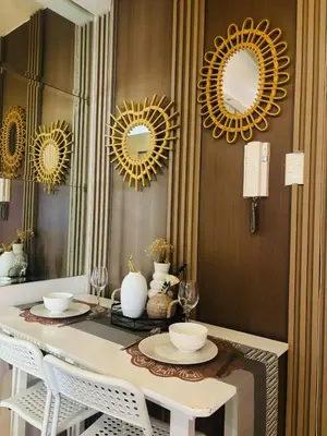 a dining room with mirrors and a table with chairs at SMDC SHORE 1 Residences, TOWER A in Manila
