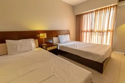 a bedroom with two beds and a window at Twin Bed Hotel Type by Ph Philstay in Manila
