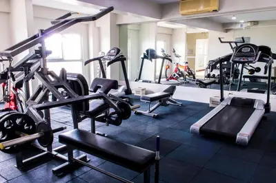 a gym with several treadmills and cardio machines at Twin Bed Hotel Type by Ph Philstay in Manila