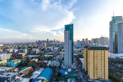 a view of a city with tall buildings at Twin Bed Hotel Type by Ph Philstay in Manila