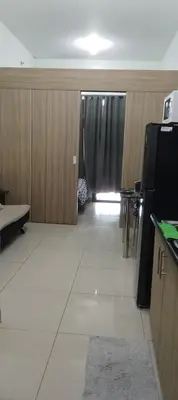 an empty room with a kitchen and a door with a window at Shore 2 Staycation nice Homes in Manila
