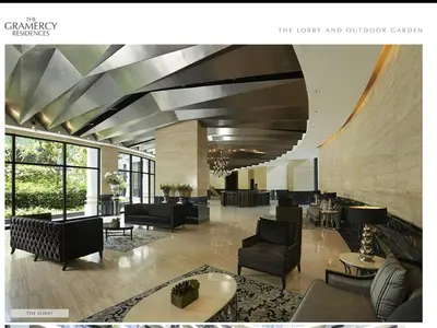 a lobby with couches and chairs and tables and windows at New York- Inspired Condo in Makati in Manila