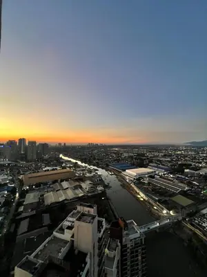 an aerial view of a city with a river at Cozy Place near Eastwood in Manila