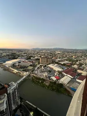 an aerial view of a city with a river at Cozy Place near Eastwood in Manila