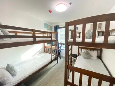a room with two bunk beds and a window at 2 BR Unit with 180 degree view in Ortigas in Manila