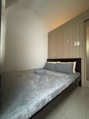 a bedroom with a large bed in a room at Condo in Pasay in Manila