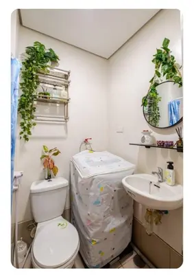 a bathroom with a toilet and a sink at Benjamin's crib staycation in Manila