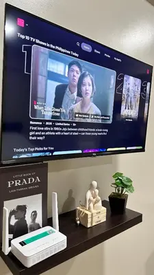 a flat screen tv sitting on a shelf at Newport City across NAIA Terminal 3 by II JDs Aparthotel in Manila
