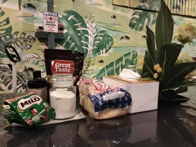 a table topped with a jar of cream cheese and snacks at Natural Haven with Netflix Kubo Videoke & Alfresco Dining in Dasmariñas