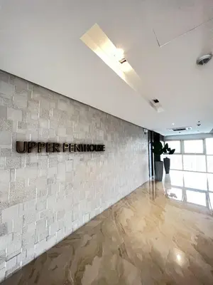 an empty room with a sign on the wall at 2BR Solana Suite 4 at Coast Residences in Manila