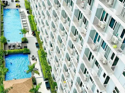an overhead view of an apartment building with two swimming pools at 2BR Solana Suite 4 at Coast Residences in Manila