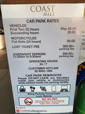 a sign for a cost mall car park rates at 2BR Solana Suite 4 at Coast Residences in Manila