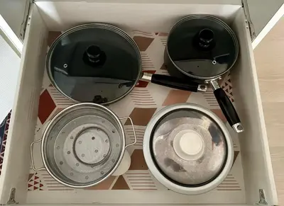 two pans and a mirror in a box at Azure Urban Resort Residences in Manila