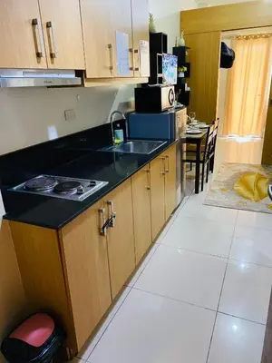 a kitchen with a sink and a counter top at triple-D in Manila