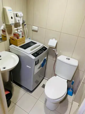 a small bathroom with a toilet and a sink at triple-D in Manila