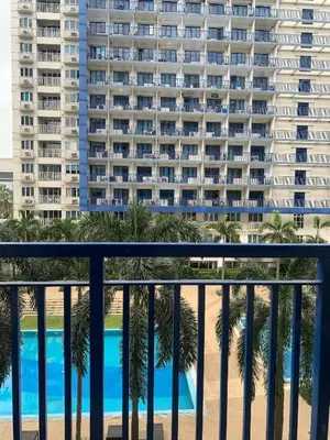 a view of a large apartment building from a balcony at Sea Residence in Manila