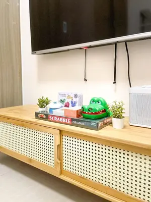 a wooden counter with a microwave on top at Rosemary Shore 2 Residences 1BR in Manila
