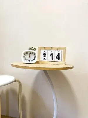 a clock and a alarm clock sitting on a shelf at Rosemary Shore 2 Residences 1BR in Manila