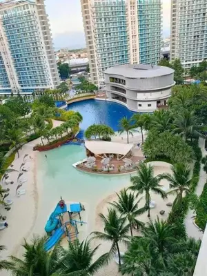 a large water park in a city with tall buildings at Casa Rhea in Manila