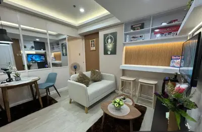 a living room with a couch and a table at Casa Rhea in Manila