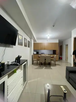 a living room with a couch and a table at Moa view with big balcony 558 in Manila