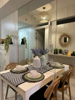 a dining room with a table with plates on it at Casa Alia at Coast - near MOA, US Embassy, PICC, WTC in Manila