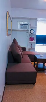 a living room with a couch and a table at Avida sm sucat quest house condo hotel in Manila