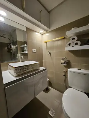 a bathroom with a sink and a toilet at Luxury Condotel near MOA, NAIA in Manila