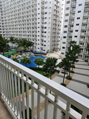 a view from the balcony of a apartment building at Luxury Condotel near MOA, NAIA in Manila