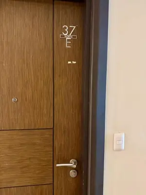 a wooden door with the number on it at BGC One Uptown Premium 2BR Suite with Balcony near Supermarket, Malls and Restaurants in Manila
