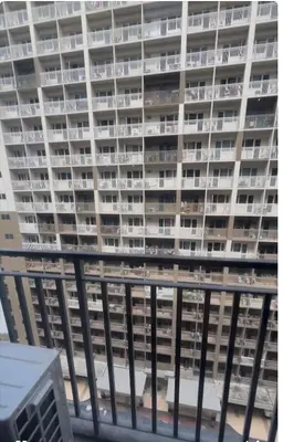 a large apartment building with balconies on a balcony at Shore 3 Tower 3 1BD - MOA Complex in Manila