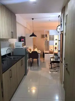 a kitchen with a sink and a dining room at Shore B 524 in Manila