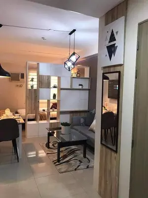 a living room with a couch and a table at Shore B 524 in Manila