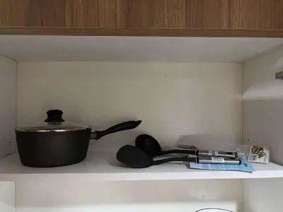 a pot and a pan on top of a stove at Shore Residence Tower 1 Staycation in Manila
